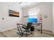 Bright home office space with a large computer monitor and a view of the outside at 513 Meres Blvd, Tarpon Springs, FL 34689