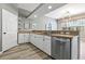 Modern kitchen featuring white cabinets, stainless steel appliances, and ample counter space at 513 Meres Blvd, Tarpon Springs, FL 34689