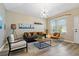 Comfortable living room featuring modern lighting, neutral walls, and attractive decor at 513 Meres Blvd, Tarpon Springs, FL 34689