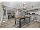 Spacious living area showcasing an open floor plan with dining, living and kitchen areas at 513 Meres Blvd, Tarpon Springs, FL 34689