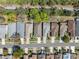 Aerial view capturing well-maintained homes on a street with mature trees, offering a peaceful residential setting at 5492 Legend Hills Ln, Spring Hill, FL 34609