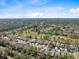 An aerial shot of a neighborhood adjacent to a golf course at 5492 Legend Hills Ln, Spring Hill, FL 34609