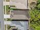 Overhead view of a home, nestled between other houses, with a well-kept lawn and a nearby tree line at 5492 Legend Hills Ln, Spring Hill, FL 34609
