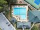 Aerial view of community pool, tennis courts, playground and community buildings at 5492 Legend Hills Ln, Spring Hill, FL 34609