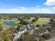 Overhead view featuring the well-maintained golf course and inviting clubhouse at 5492 Legend Hills Ln, Spring Hill, FL 34609