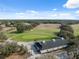 Wide angle view of the golf course showing the green and surroundings at 5492 Legend Hills Ln, Spring Hill, FL 34609