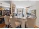 Bright eat-in kitchen featuring granite countertops and a cozy breakfast bar with seating at 5492 Legend Hills Ln, Spring Hill, FL 34609