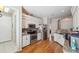 Open kitchen with white cabinets, granite countertops, and stainless-steel appliances at 5492 Legend Hills Ln, Spring Hill, FL 34609