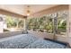 Screened patio with a ceiling fan, and a view of the natural surroundings at 5492 Legend Hills Ln, Spring Hill, FL 34609