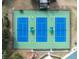 Aerial view highlighting the well-maintained community tennis court complex at 5492 Legend Hills Ln, Spring Hill, FL 34609