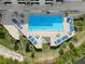 Aerial view of resort-style pool with tanning deck and lounge chairs at 5915 Sea Ranch Dr # 211, Hudson, FL 34667