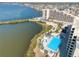 Scenic aerial view featuring a swimming pool near the condo building and beautiful waterfront at 5915 Sea Ranch Dr # 211, Hudson, FL 34667
