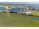 Incredible aerial view of modern condo complex with waterfront access, manicured landscaping, and beautiful surroundings at 5915 Sea Ranch Dr # 211, Hudson, FL 34667
