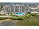 Beautiful waterfront condo featuring a lovely pool and lush landscaping at 5915 Sea Ranch Dr # 211, Hudson, FL 34667