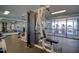 Well-equipped condominium gym with machines and water views at 5915 Sea Ranch Dr # 211, Hudson, FL 34667