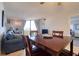 Open-concept living and dining area featuring tile floors, comfortable seating, and natural light at 5915 Sea Ranch Dr # 211, Hudson, FL 34667