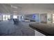 Expansive lounge area with ample seating, TV, and outdoor access, offering a perfect blend of indoor-outdoor living at 5915 Sea Ranch Dr # 211, Hudson, FL 34667