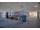 Spacious lounge area offering comfortable armchairs, a large TV, and easy access to the outdoors, great for socializing at 5915 Sea Ranch Dr # 211, Hudson, FL 34667