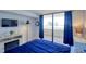 Cozy bedroom with a view of the water, sliding glass door to patio and comfortable king bed at 5915 Sea Ranch Dr # 211, Hudson, FL 34667