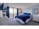 Well-lit main bedroom with neutral tones, slider to patio and water views at 5915 Sea Ranch Dr # 211, Hudson, FL 34667