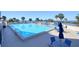 Resort-style swimming pool with water view and plenty of lounge chairs available at 5915 Sea Ranch Dr # 211, Hudson, FL 34667