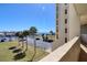 Beautiful view of palm trees and harbor from condo hallway at 5915 Sea Ranch Dr # 211, Hudson, FL 34667
