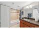 Cozy bathroom with tiled shower, vanity, and ample storage space at 6035 Sea Ranch Dr # 408, Hudson, FL 34667