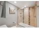 A full bath with tile floors and shower featuring a glass door at 6035 Sea Ranch Dr # 408, Hudson, FL 34667