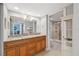 A full bath with a double-sink granite counter, tile floors and a shower with glass doors at 6035 Sea Ranch Dr # 408, Hudson, FL 34667