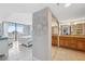 An open-concept view to a bedroom and bath, filled with light, tile floors and a view at 6035 Sea Ranch Dr # 408, Hudson, FL 34667