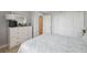 Bright bedroom with closet and dresser space, tile flooring, and calm color scheme at 6035 Sea Ranch Dr # 408, Hudson, FL 34667