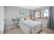 Calming bedroom featuring a window, neutral color palette, and an accent painting at 6035 Sea Ranch Dr # 408, Hudson, FL 34667