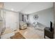 A relaxing den features tile floors, white recliner, and neutral paint at 6035 Sea Ranch Dr # 408, Hudson, FL 34667