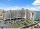 Exterior view showcasing the building, convenient parking, and waterfront location with docks at 6035 Sea Ranch Dr # 408, Hudson, FL 34667