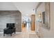 Condo foyer features grey wood look accent wall and leads to kitchen with water views at 6035 Sea Ranch Dr # 408, Hudson, FL 34667