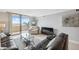 Comfortable living room with sliding glass doors that lead to a balcony and overlook the beach at 6035 Sea Ranch Dr # 408, Hudson, FL 34667
