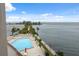 A luxury swimming pool overlooks the Gulf waters at 6035 Sea Ranch Dr # 408, Hudson, FL 34667