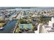 Aerial view of waterfront properties, tennis courts, marina, and lush landscaping at 6035 Sea Ranch Dr # 411, Hudson, FL 34667