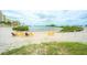 Relax on the beach with these colorful chairs and serene waterfront views at 6035 Sea Ranch Dr # 411, Hudson, FL 34667