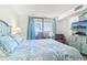 Serene bedroom featuring balcony access, a comfortable bed and a stylish dresser at 6035 Sea Ranch Dr # 411, Hudson, FL 34667