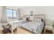 Bright bedroom features two twin beds with ocean-themed bedding and a view from the window at 6035 Sea Ranch Dr # 411, Hudson, FL 34667