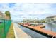 Waterfront boat dock featuring slips, boats, and scenic harbor views at 6035 Sea Ranch Dr # 411, Hudson, FL 34667