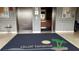 Lobby area with a welcome mat, elevator, tile flooring, and decorative wall panels at 6035 Sea Ranch Dr # 411, Hudson, FL 34667