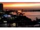 Evening view of bayfront condo with lush landscaping and a beautiful sunset at 6035 Sea Ranch Dr # 411, Hudson, FL 34667