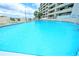Community pool with lots of clear blue water and plenty of room for swimming at 6035 Sea Ranch Dr # 411, Hudson, FL 34667