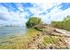 Waterfront view of bridge over rocky beach with clear water and scenic views at 6035 Sea Ranch Dr # 411, Hudson, FL 34667