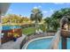 Backyard showcases a sparkling pool, verdant landscaping, and a serene ambiance, perfect for outdoor enjoyment at 625 Lafayette Blvd, Oldsmar, FL 34677