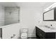 Modern bathroom with a tiled shower, a sink with marble countertop, and neutral colors at 625 Lafayette Blvd, Oldsmar, FL 34677