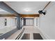 Garage home gym featuring a mirror, exercise equipment, and neutral colored walls at 625 Lafayette Blvd, Oldsmar, FL 34677