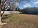 Backyard with wire fence and gate overlooking the road at 6361 Boxwood St, Brooksville, FL 34602
